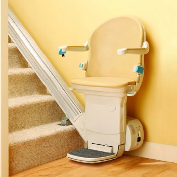 Stairlift installed at the bottom of a staircase.