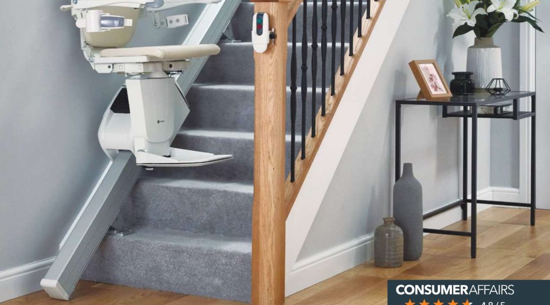 A stairlift is installed on a staircase in a home.