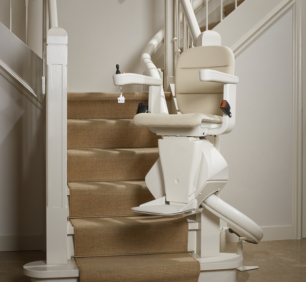 A white stairlift was installed on a staircase.