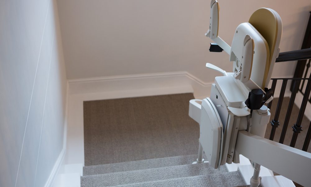 A stairlift installed on a staircase in a home.