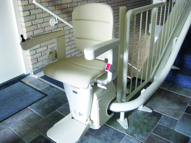 A stairlift installed on a staircase inside a building.