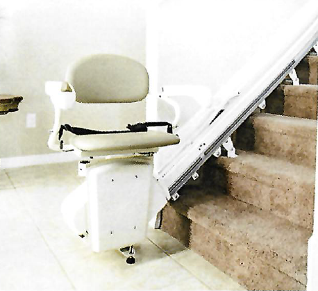 Stair lift chair at the bottom of a staircase, providing accessibility solution for going upstairs.