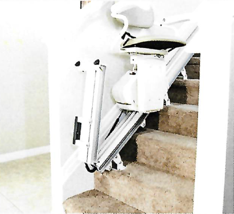 Stairlift installed on a staircase to assist with mobility.