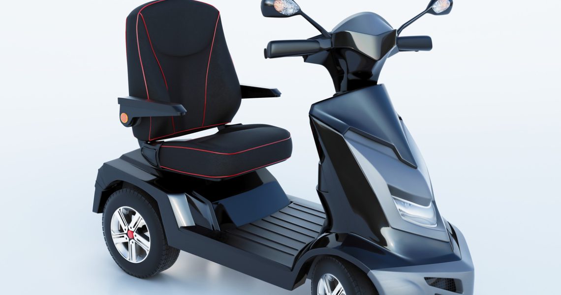 Modern black mobility scooter with comfortable seat against a white background.
