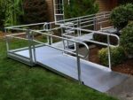 A modular wheelchair ramp installed in front of a residential home.